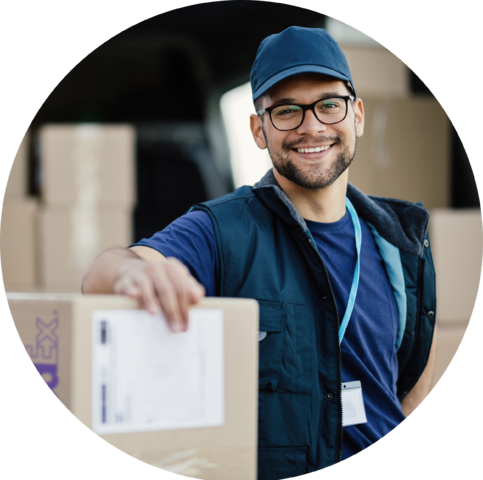 FedEx worker posing with FedEx box