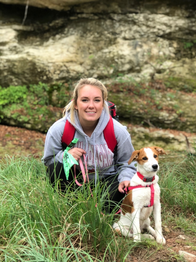 Mikayla Middleton, Account Executive at ShipEngine on a hike with her dog.