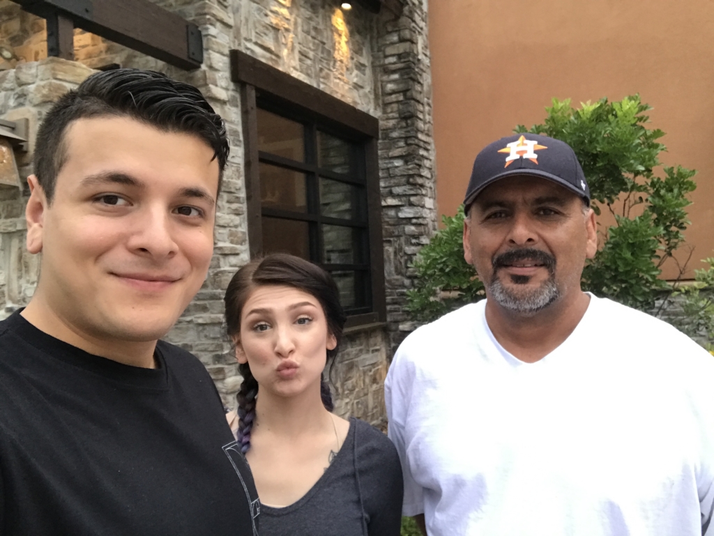 Kasey Cantu, Implementation Project Manager at ShipEngine photographed with dad and girlfriend