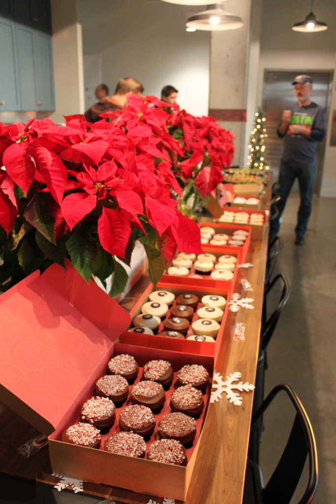 Sprinkles cupcakes lined up for the ShipEngine and Austin Homegrown API Holiday Tech Meetup Mixer