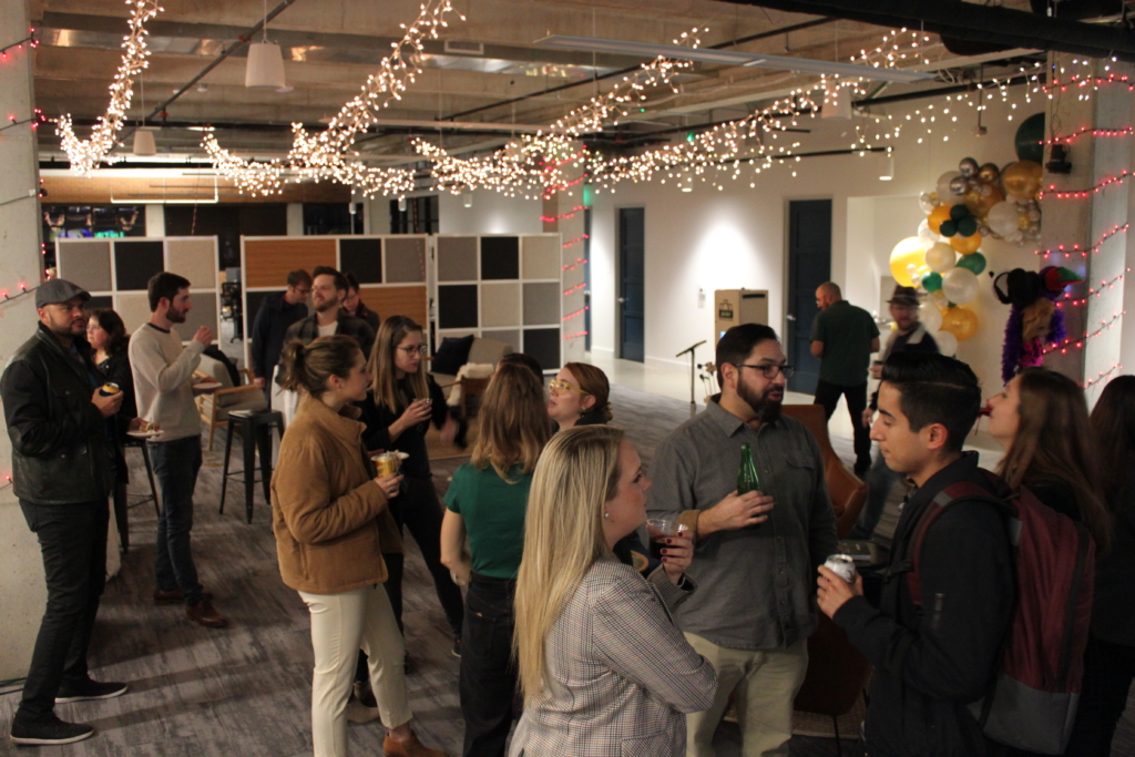 Tech professionals mingling at ShipEngine and Austin Homegrown API Meetup Holiday Tech Meetup Mixer