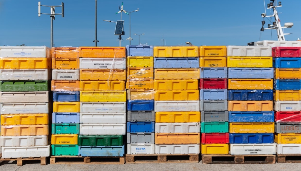 rows of stacked international shipping containers